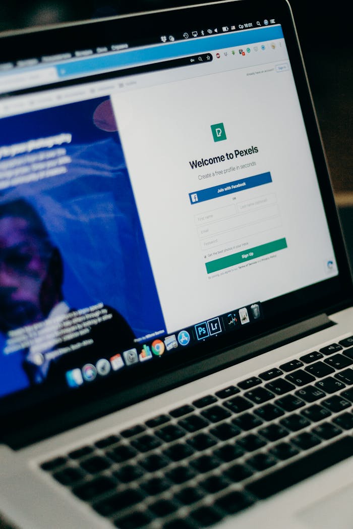 heros-img Close-up view of a laptop displaying a sign-up page for an online platform.